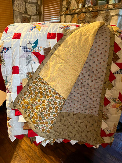 100 year old quilt top restored and finished.