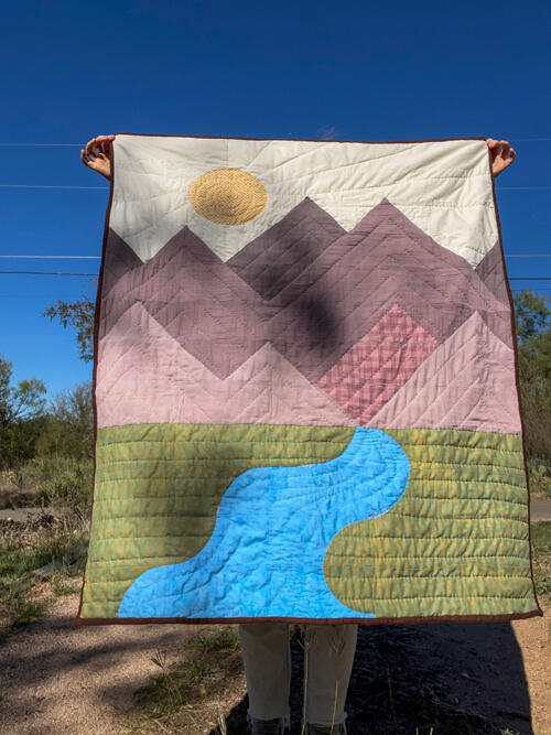 Baby quilt with hand stitching